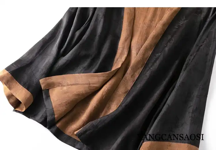 Fabric texture close-up revealing natural mulberry silk fibers and plant-dyed finish.