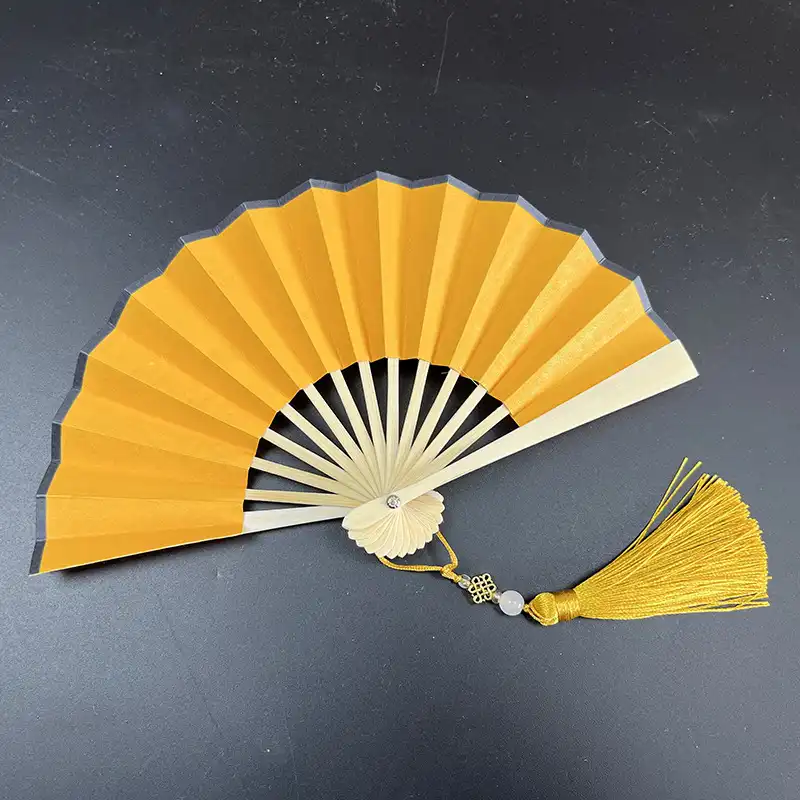 Paper fan displayed as home decoration wall art showing versatile interior styling applications.