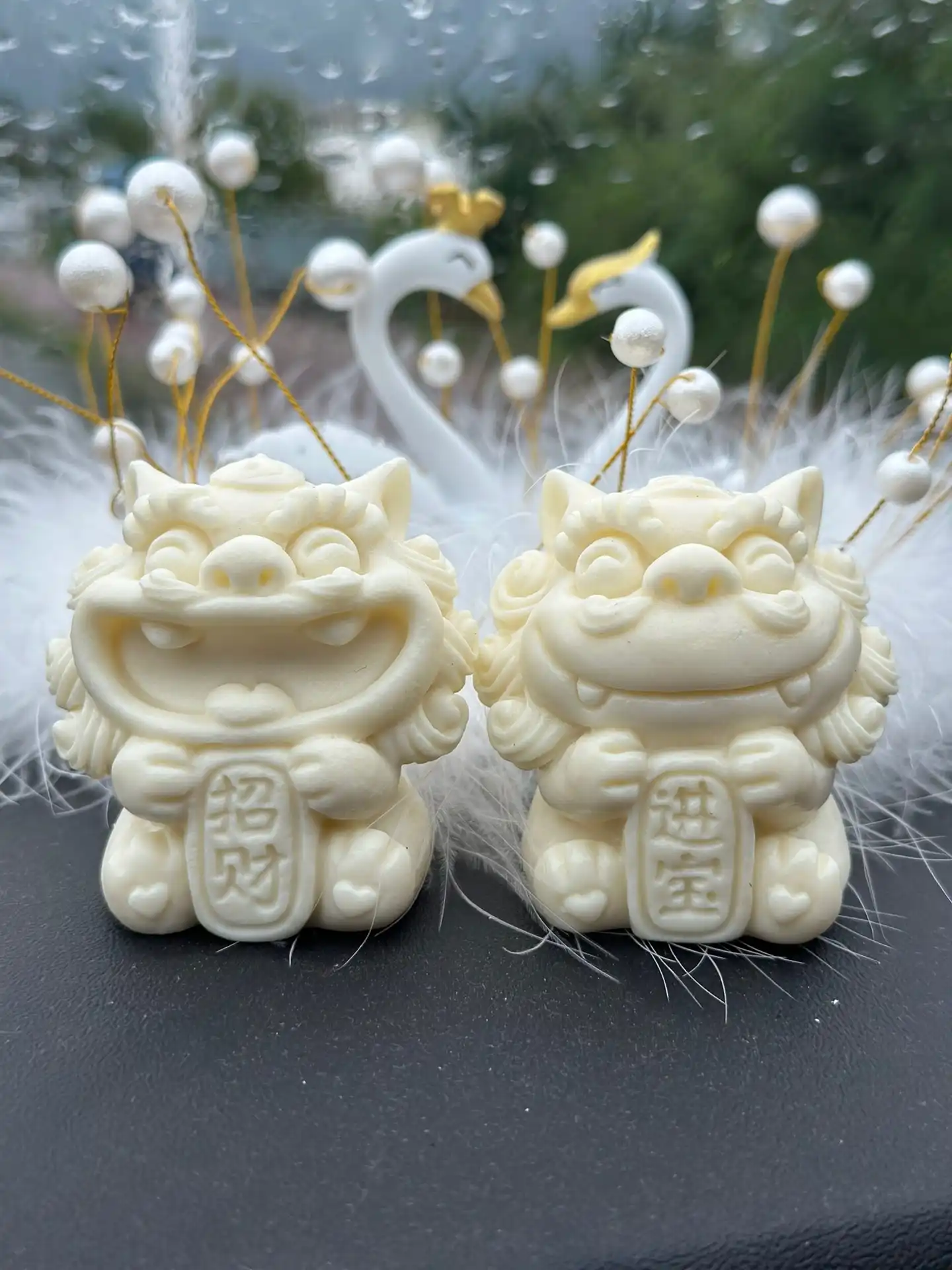 Pair of coconut carved fortune lions positioned together for feng shui wealth protection display.