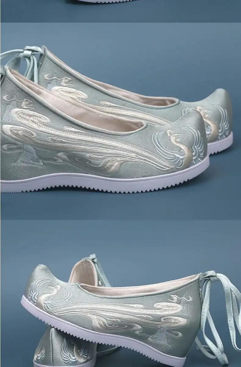 Phoenix embroidered Chinese wedding shoes with red canvas and gold thread traditional Hanfu footwear.