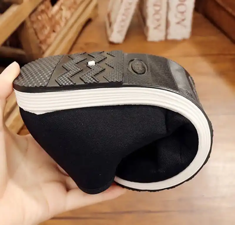 Traditional black Chinese kung fu shoes for men showing classic martial arts training footwear.