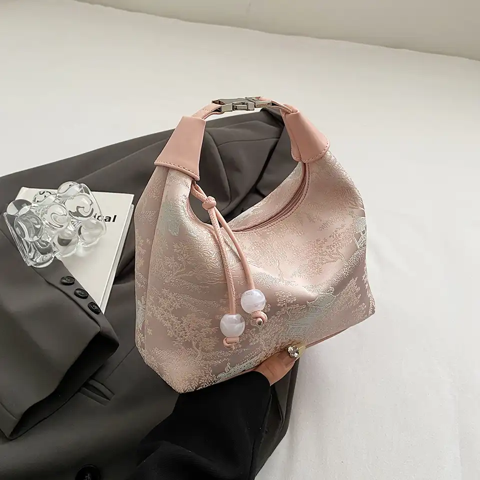 Chinese style embroidery bag with intricate floral pattern on premium silk material.