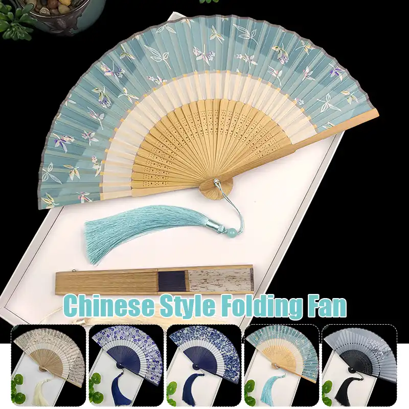 Elegant tassel decoration on silk fan adding graceful movement and visual sophistication.