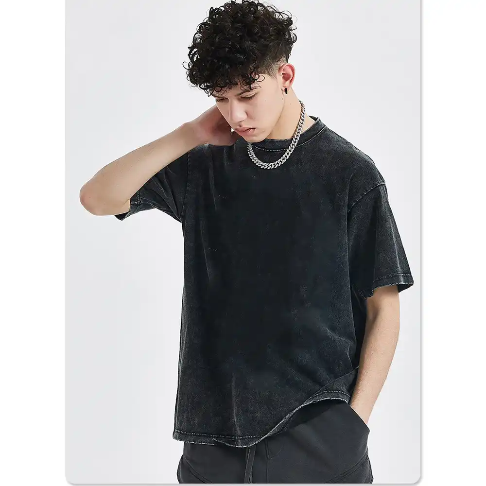 Washed black cotton anime T-shirt for men, side angle on white background..