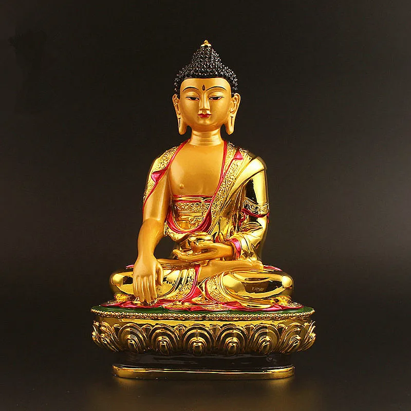Side profile view of large gold Buddha figurine displaying Tibetan Buddhist styling and proportions.