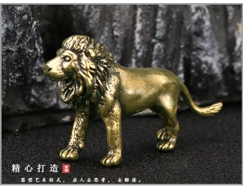 Side profile of copper lion figurine showcasing the muscular body and proud stance design.