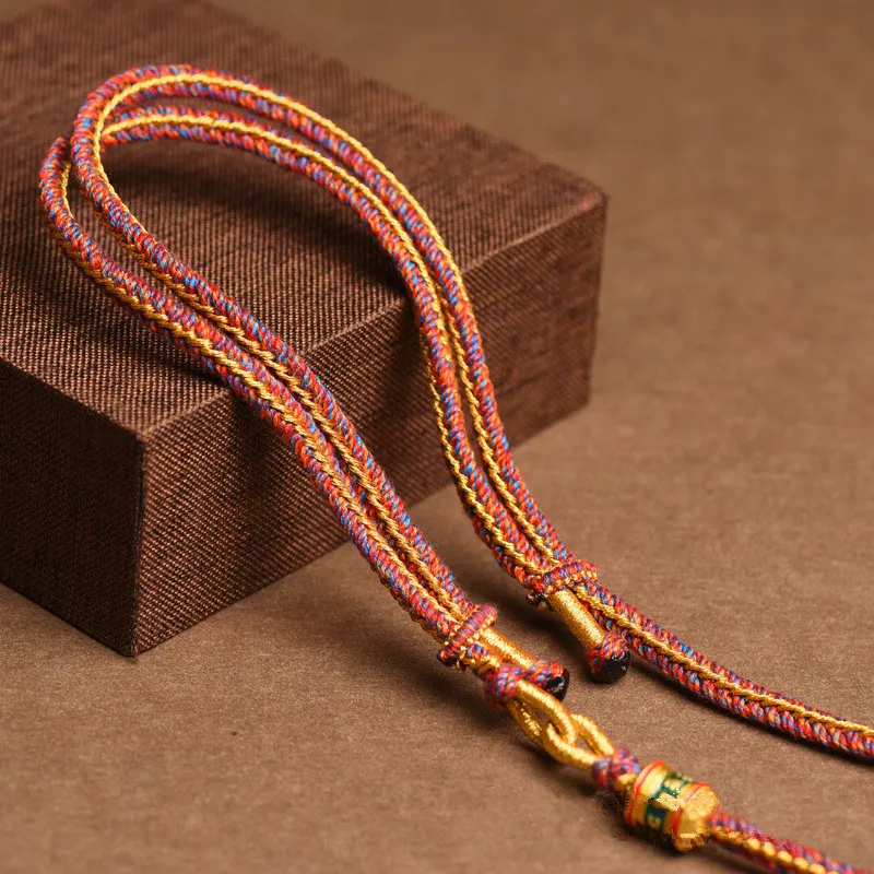 Woman wearing Tibetan thangka rope necklace ethnic style jewelry fashion portrait.