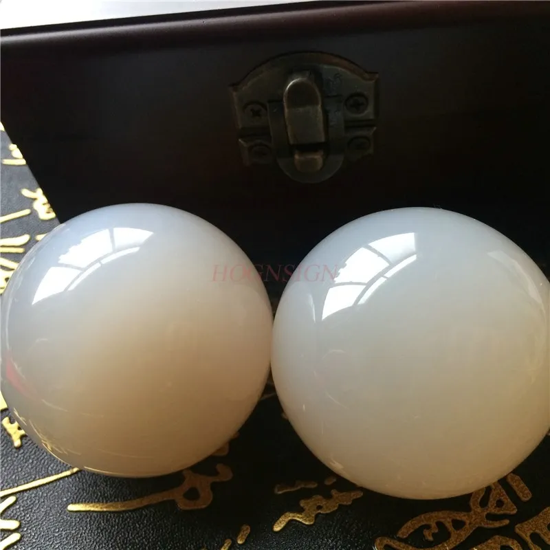 Close-up detail of natural agate stone texture and composite material quality of meditation balls.
