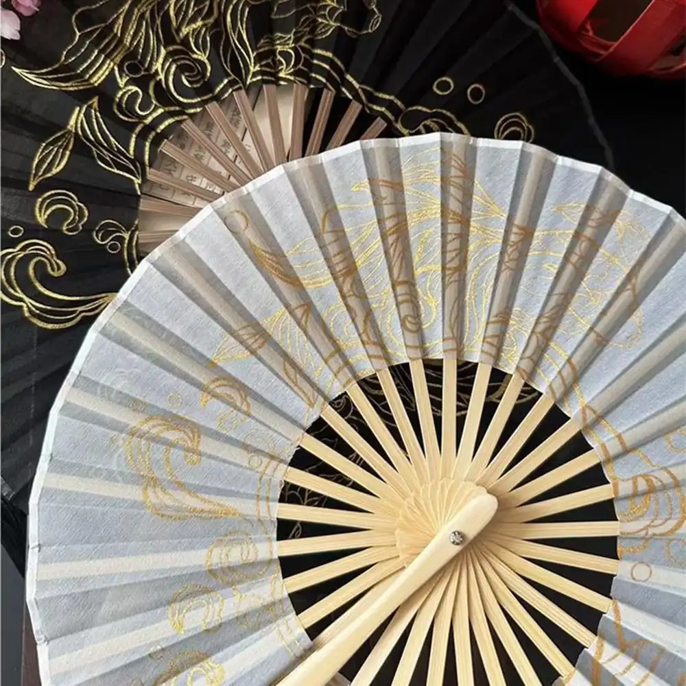 Professional dancer performing with Japanese round silk fan during traditional routine.