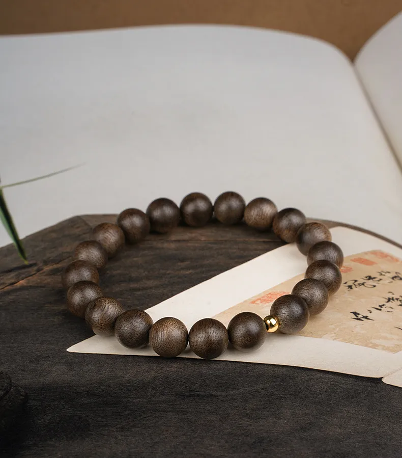 Buddhist meditation bracelet made from authentic Vietnamese Nha Trang agarwood beads.