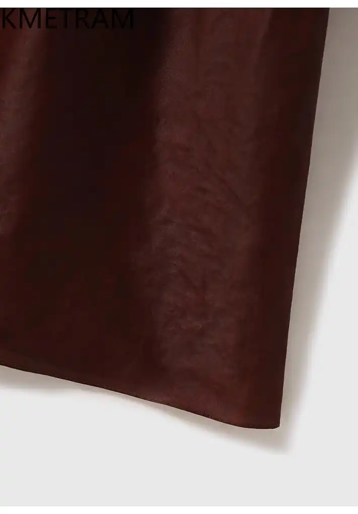 Fabric care label and quality construction details of premium Xiangyunsha silk dress.