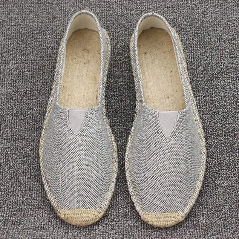 Side profile view of breathable martial arts shoes showing linen texture and anti-slip sole detail.