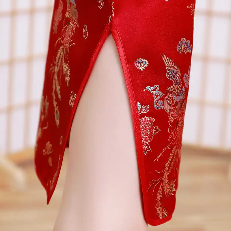 Young model in summer cheongsam dress displaying comfortable breathable fabric construction.