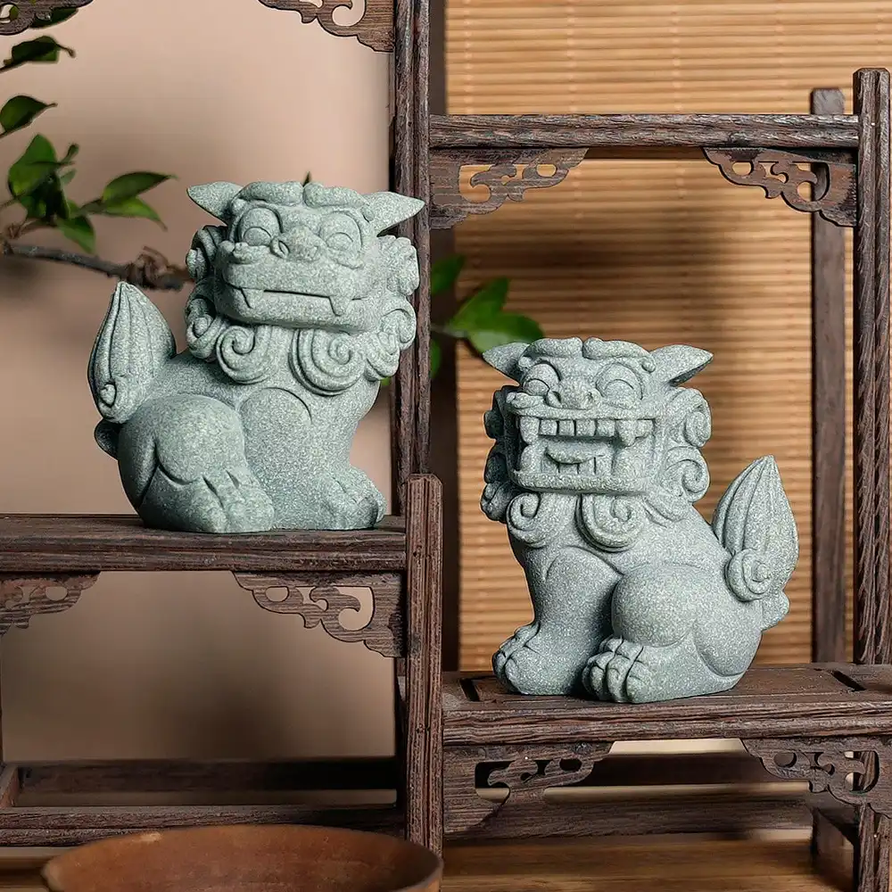 Chinese foo dog guardian lion statue pair carved from quality stone for feng shui protection.