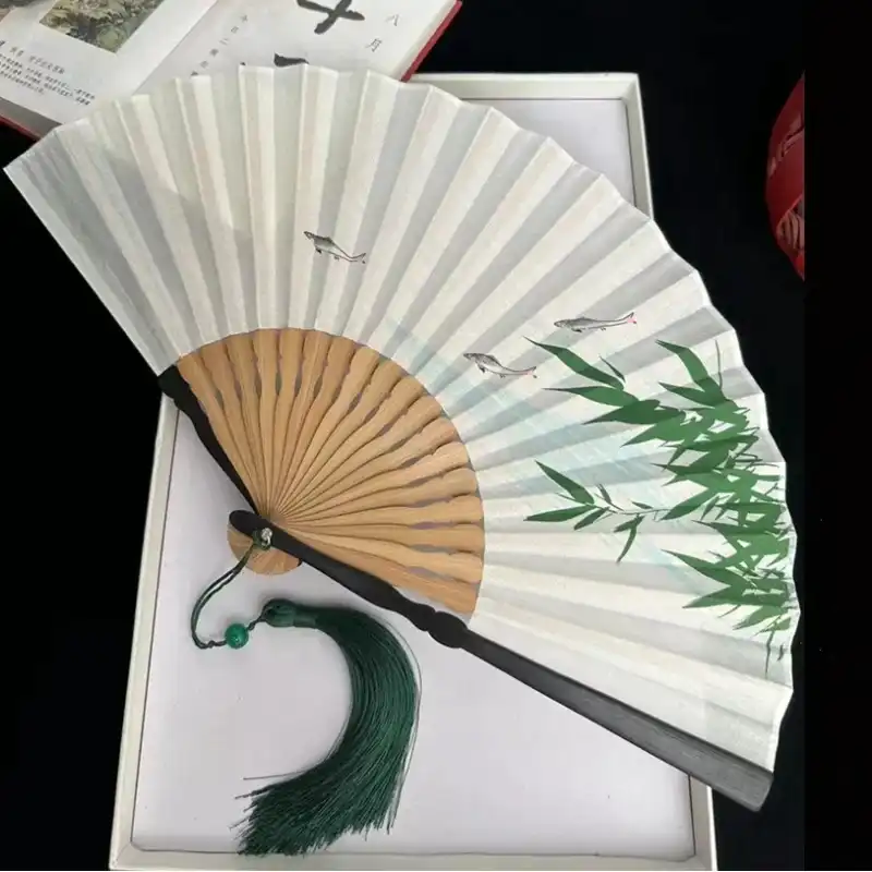 Multiple color options of ancient style dance fans showing green blue white black variations.