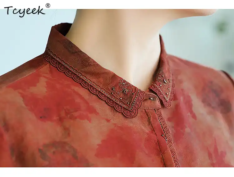 Front view of premium Gambiered Guangdong silk blouse with red floral embroidery on model.