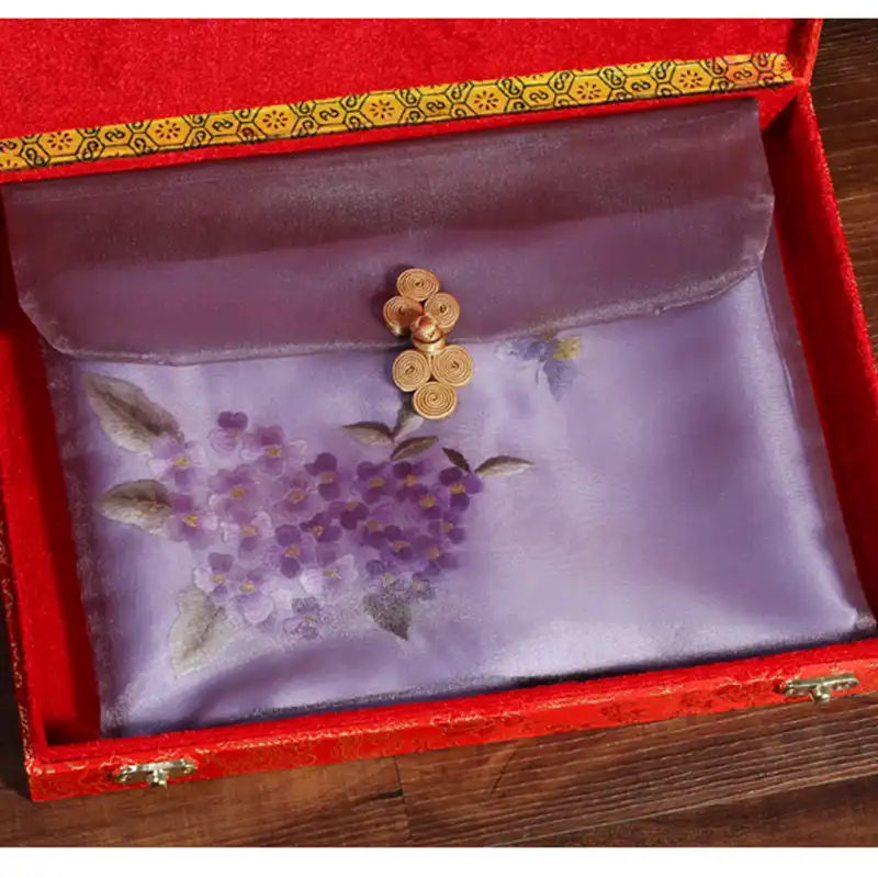 Premium quality silk scarf showing intricate Suzhou embroidery floral patterns and luxurious texture.