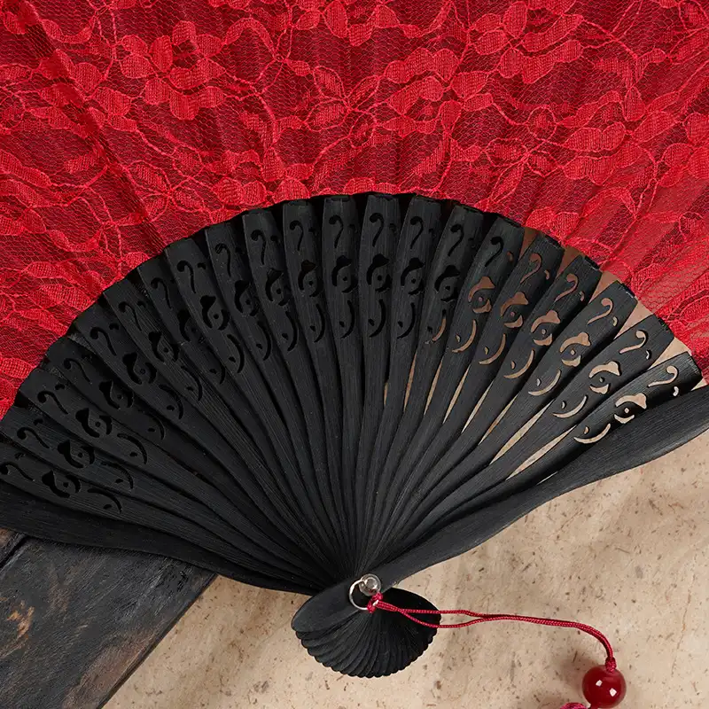 Multiple Japanese lace fans arranged showing decorative home display options.