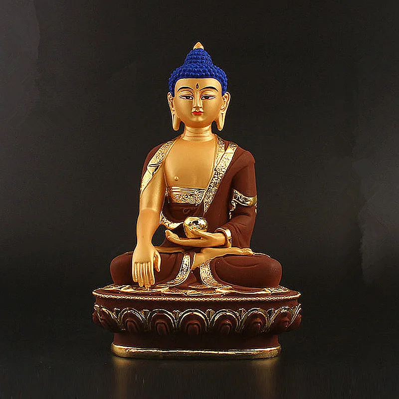 Close-up Buddha face showing serene expression bronze finish meditation statue detail view.