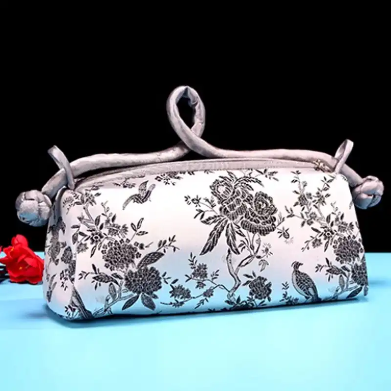 Multiple color options of silk embroidered bags arranged for comparison and selection display.