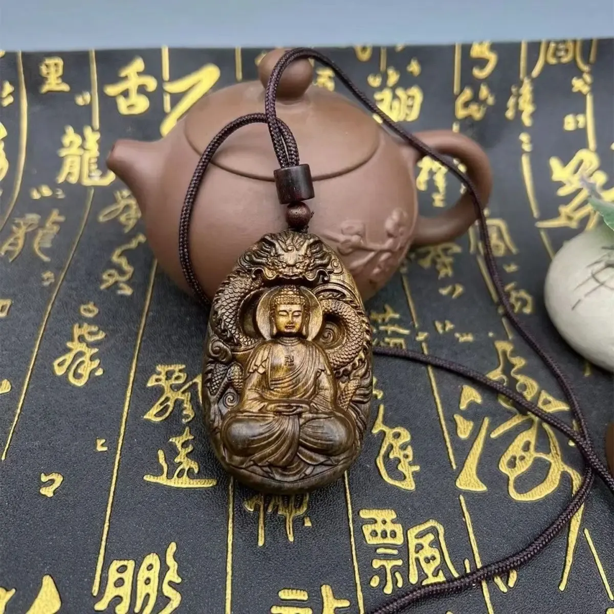 Sandalwood Tathagata Buddha pendant necklace handcrafted spiritual protection amulet jewelry.