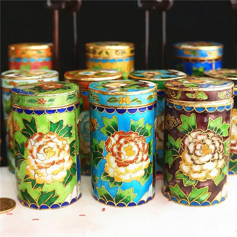Professional lighting display of cloisonne holder enamel brilliance and authentic patina.