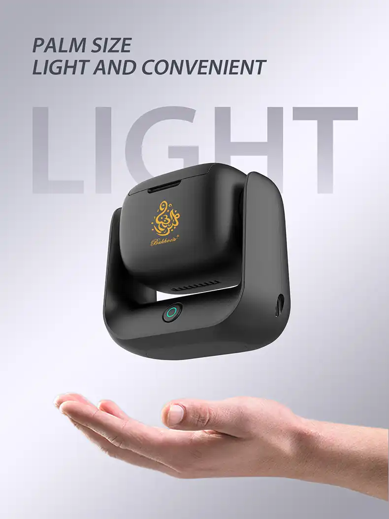 Portable electronic aroma diffuser showing USB charging port and power button with green light.