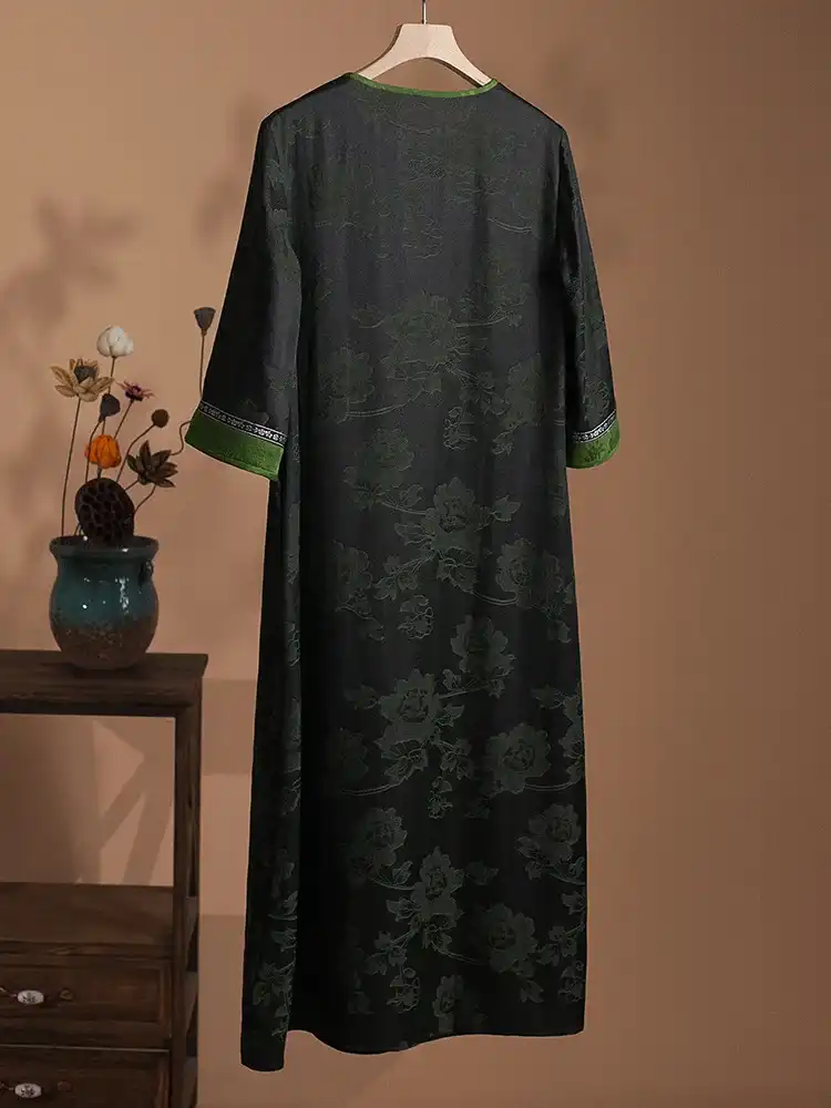 Detail view of round neckline construction and traditional Chinese dress collar design.