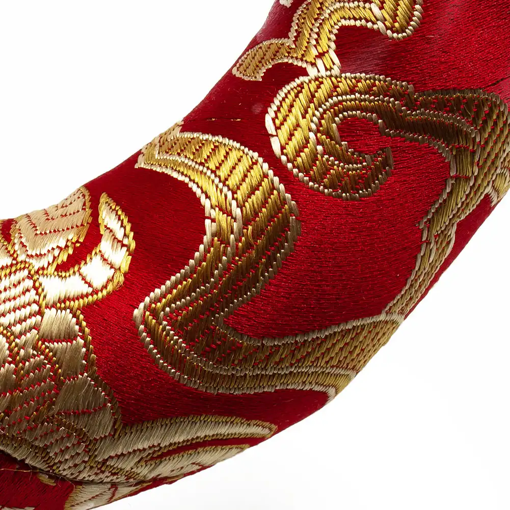 Tibetan singing bowl positioned on silk brocade pillow demonstrating perfect size matching.
