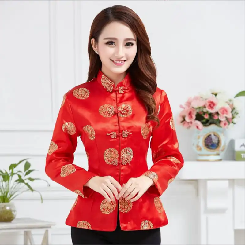 Close-up detail of premium silk fabric texture and traditional Chinese button construction.