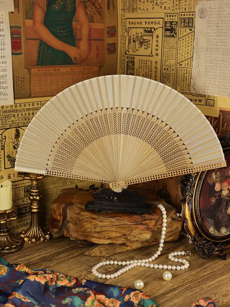 Multiple color variations of Japanese folding fans arranged showing red green beige options.