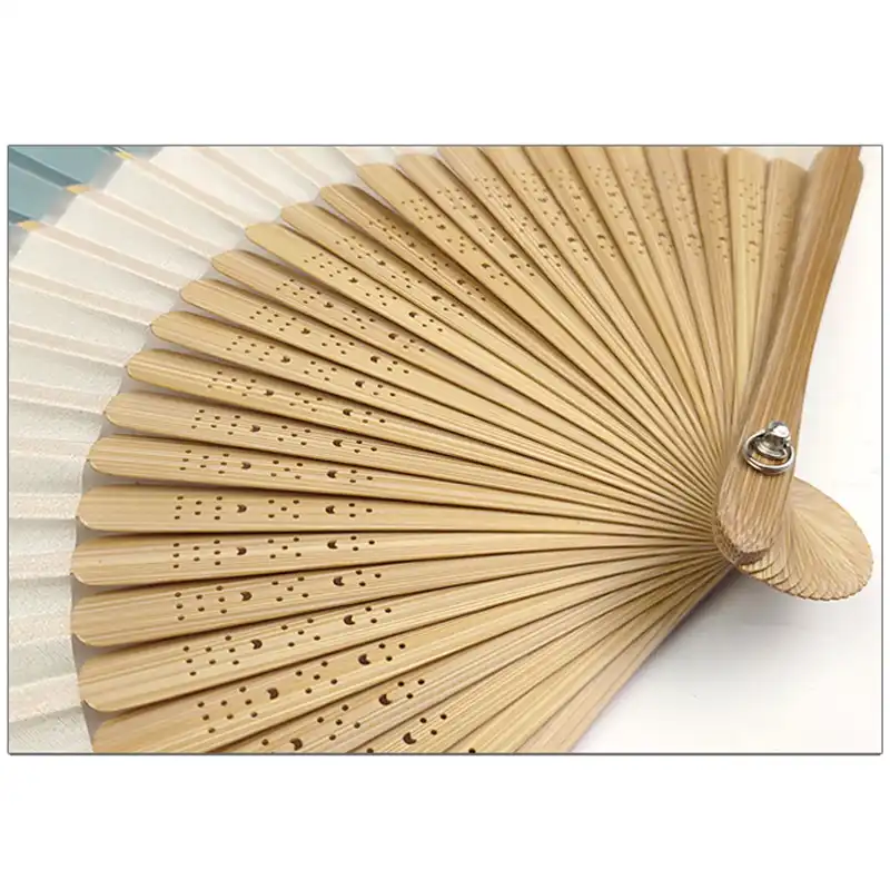 Professional portrait session using Japanese folding fan as sophisticated styling prop.