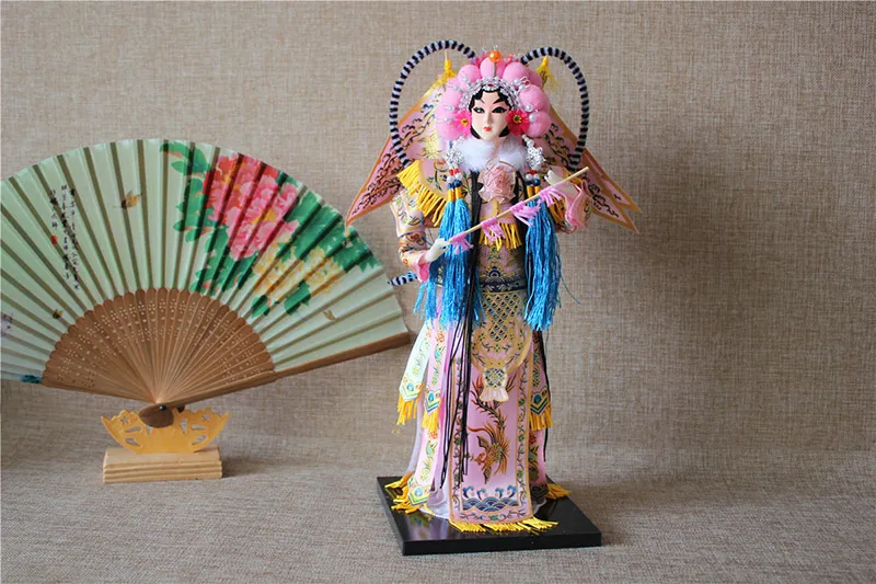 Hand-painted face detail of Chinese Peking Opera character doll with authentic makeup.