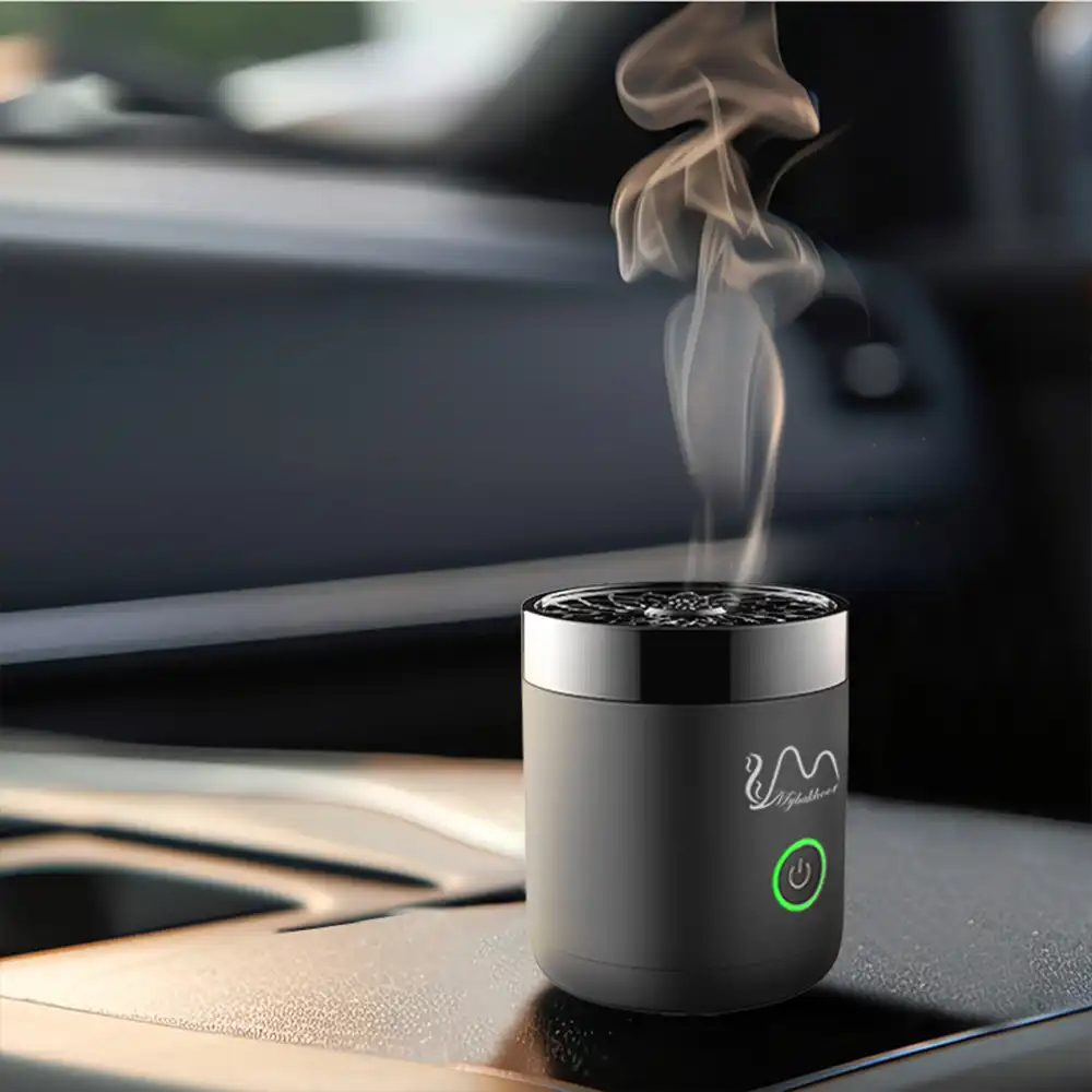 Mini electric incense burner creating aromatic smoke in car interior setting.