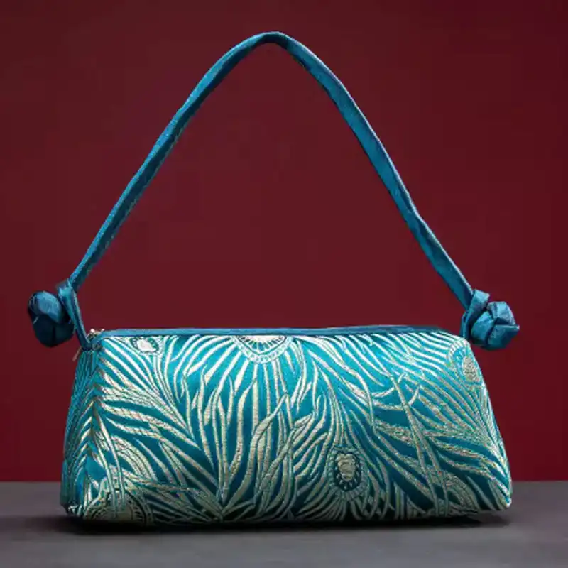 Luxury silk embroidered women evening bag showing intricate floral patterns in elegant design.