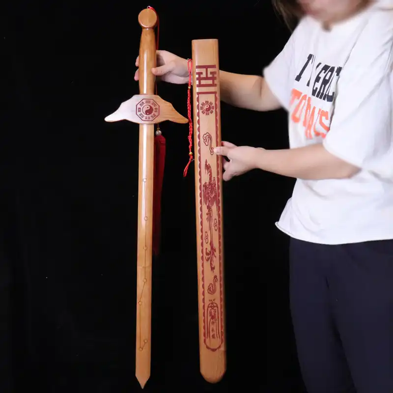 Traditional Chinese peach wood sword toy with natural wood grain finish for kids.