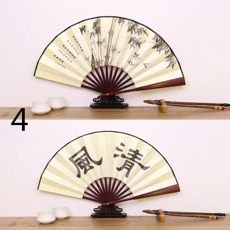 Retro Chinese silk folding fan closed showing bamboo handle and compact 27cm portable design for pocket carry.