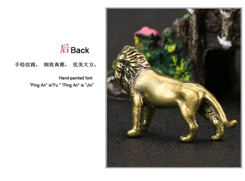 Vintage copper lion figurine with brass finish displayed on white background showing intricate details.