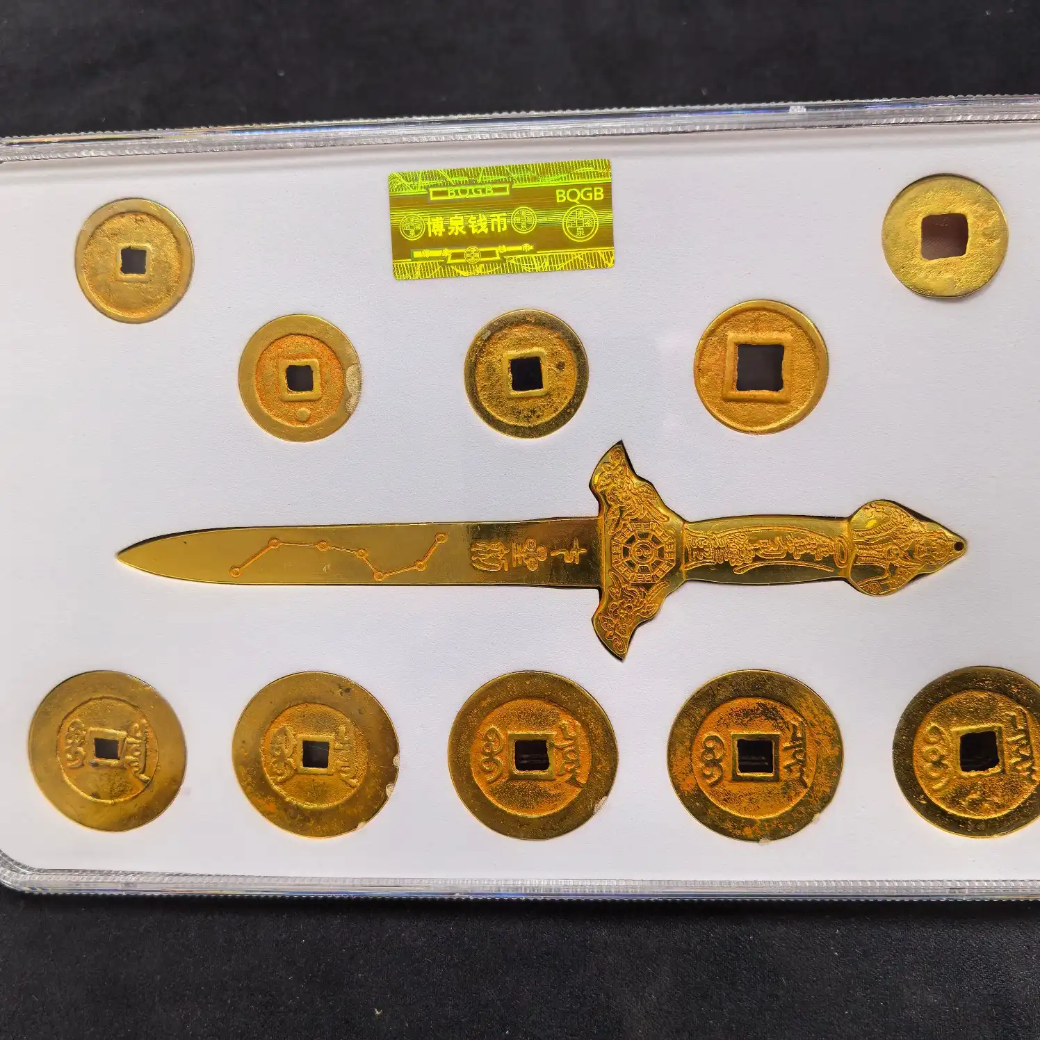 Close-up view of authentic qing dynasty copper coins arranged in seven star formation.