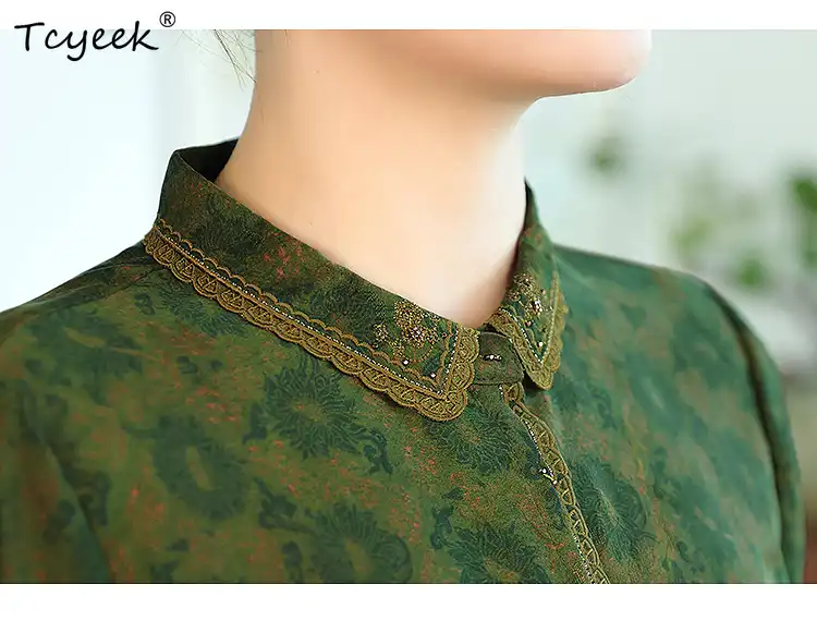 Side profile showing elegant silhouette of embroidered Guangdong silk short sleeve blouse.