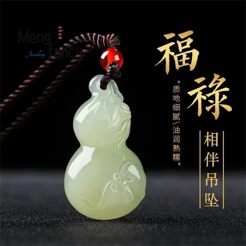 Side angle of jade gourd pendant showing three-dimensional carving and smooth finish quality.