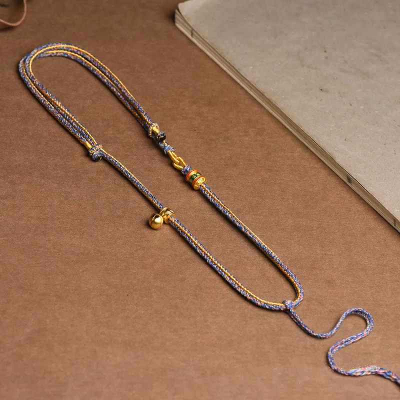 Tibetan thangka rope necklace elegant packaging ethnic jewelry gift presentation.