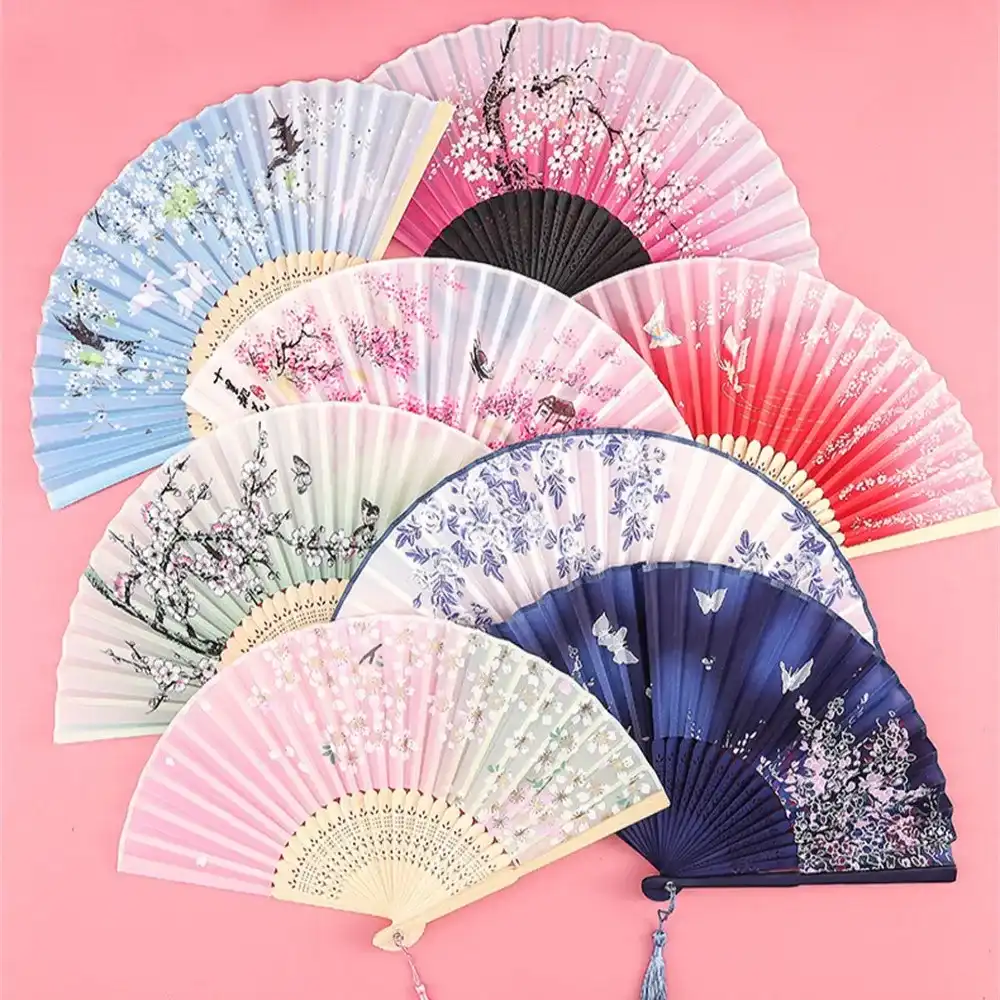 Wedding party decoration setup featuring vintage silk fans as ceremonial and atmospheric elements.