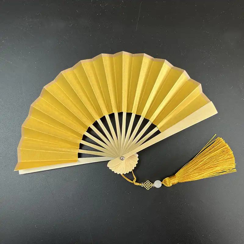 Children holding colorful paper fans demonstrating kid-friendly size and safe construction materials.