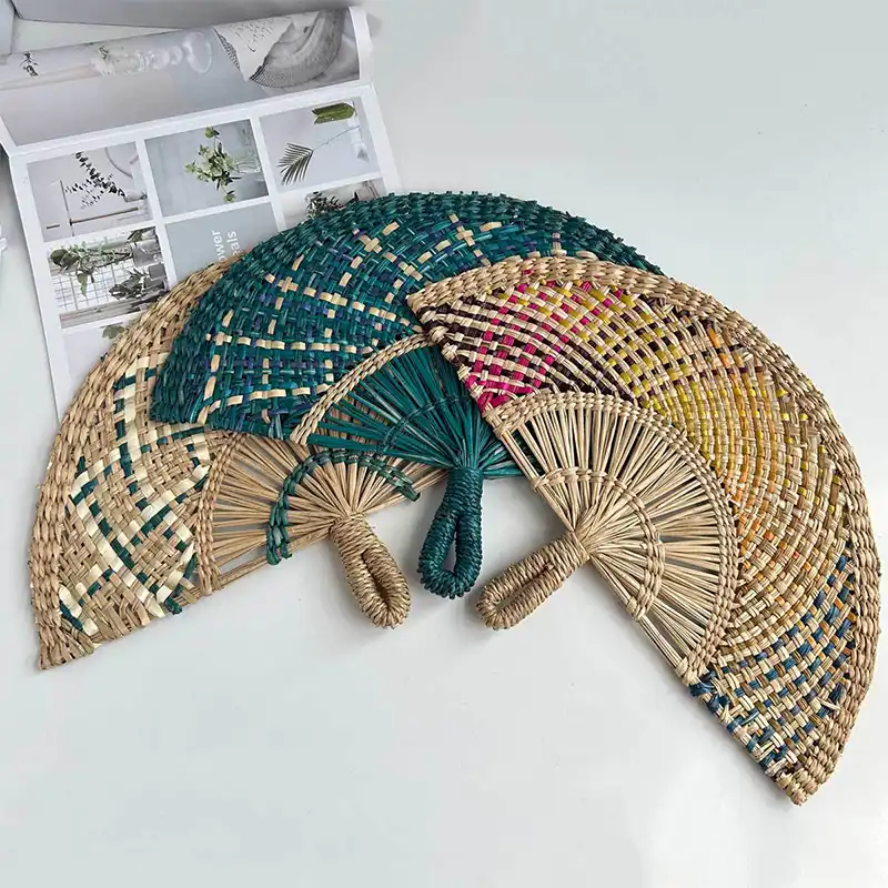 Japanese style handwoven straw fan displayed showing semicircular shape and natural weaving texture.