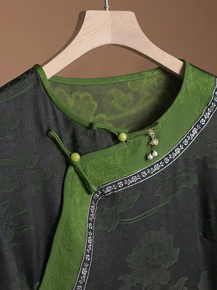 Back view displaying traditional Chinese Tang suit styling and natural waistline of silk Qipao.