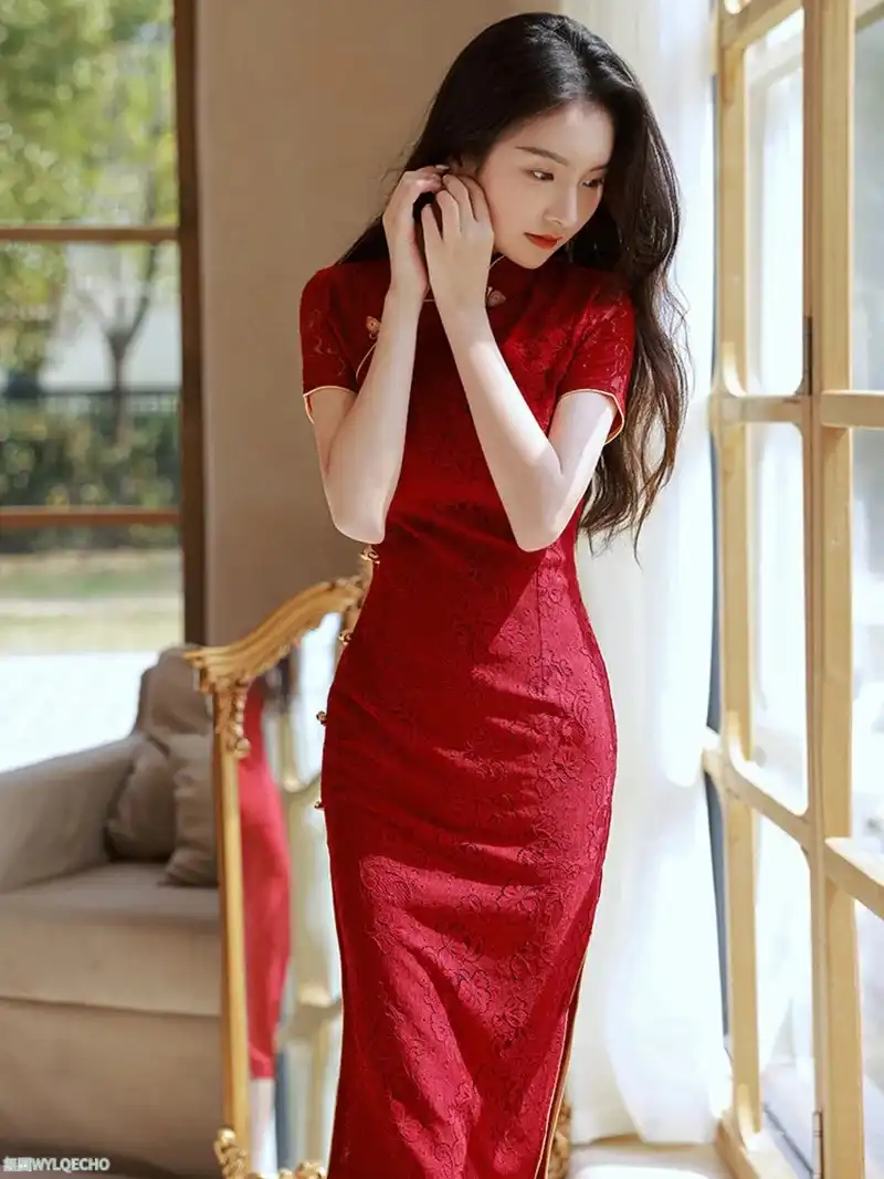 Back view of wine red cheongsam showing lace detailing and slim-fit dress construction.