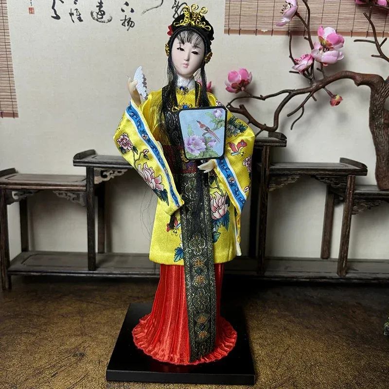 Detailed hand-painted opera mask face on authentic Chinese porcelain doll collectible.
