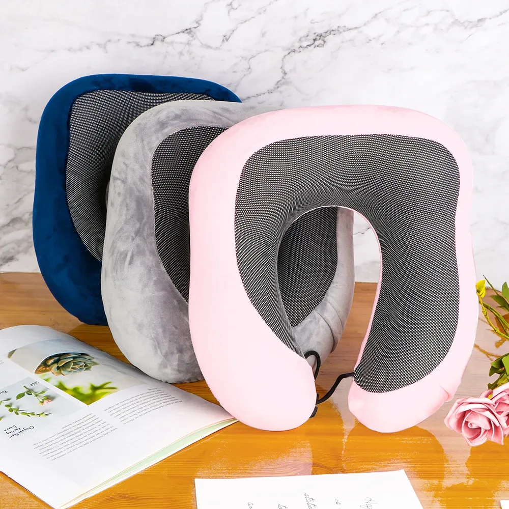 Memory foam U-shaped travel cervical pillow with soft cotton cover in navy blue on white background.