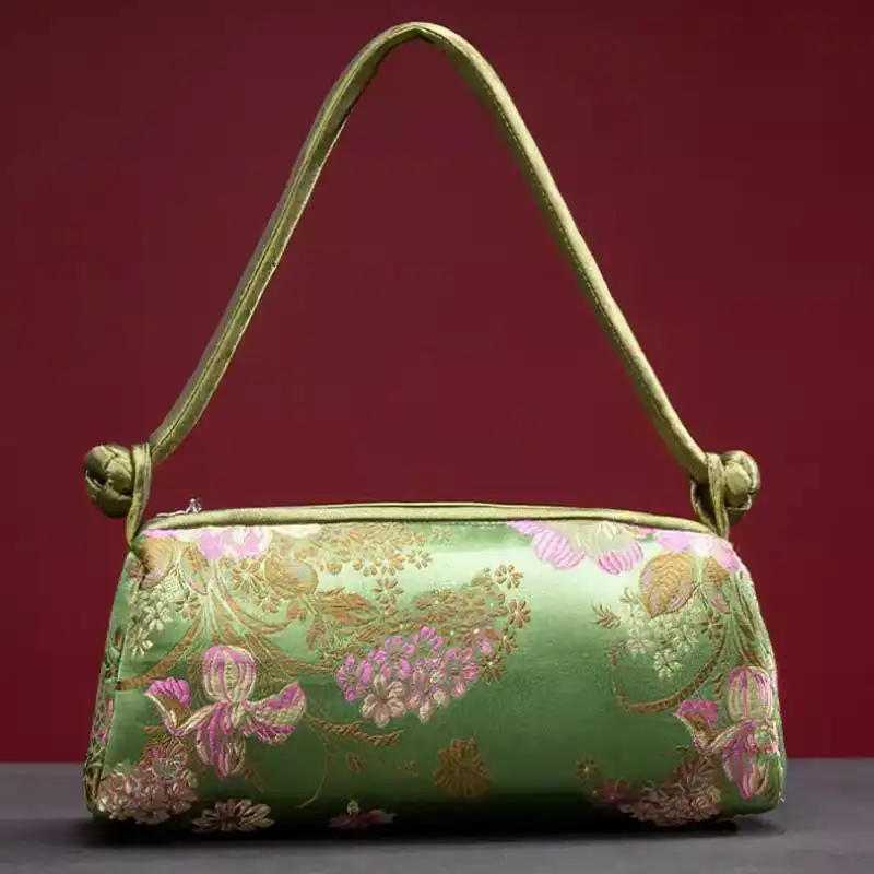 White silk embroidered bridal clutch bag perfect for wedding ceremonies and special occasions.